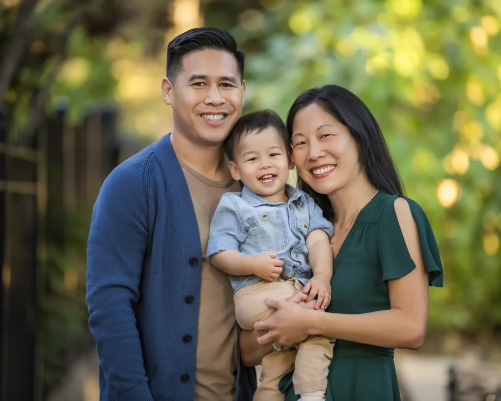 Portrait of an asian family of three under oak trees in Glencoe